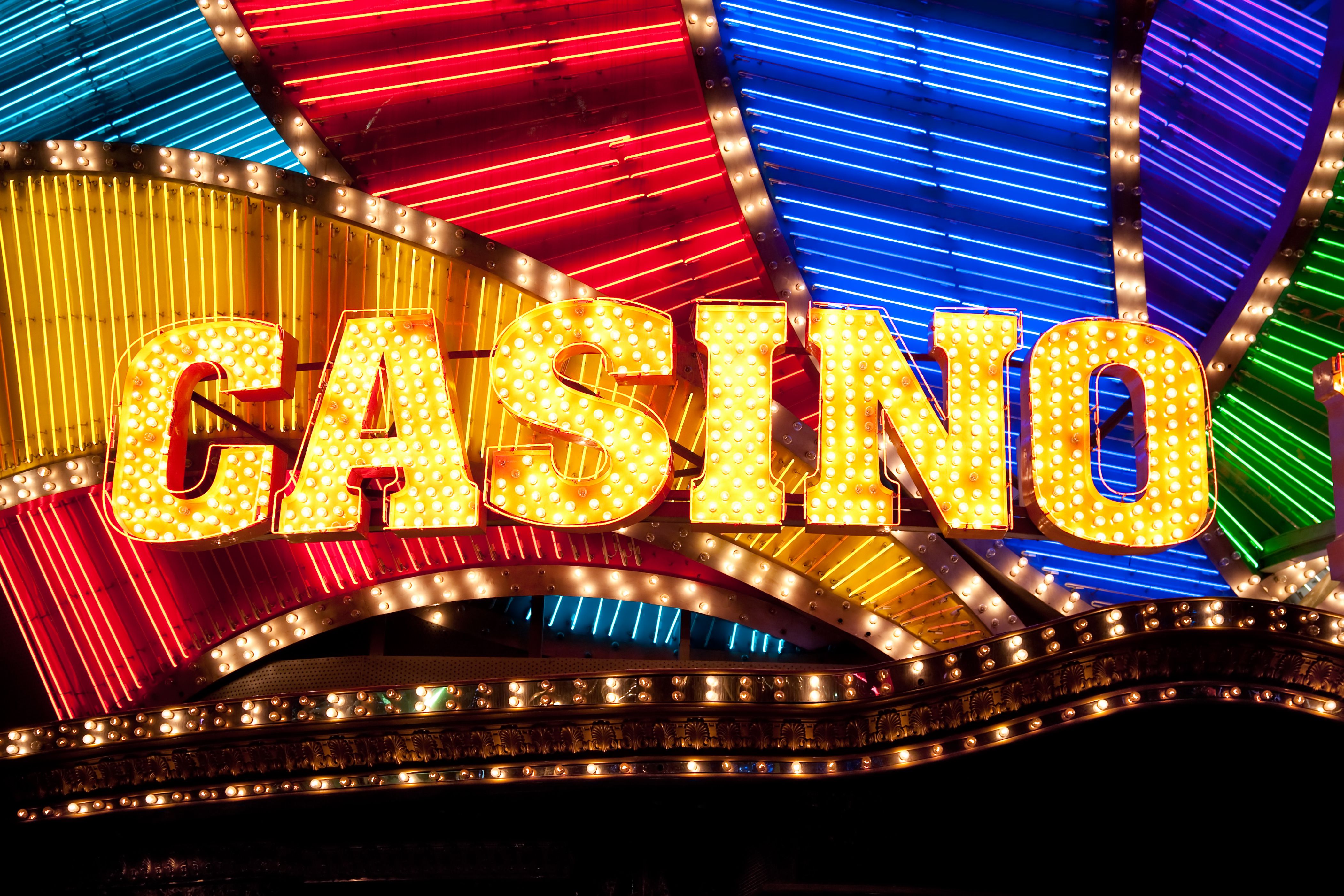 A stunning photo of The Commerce Casino exterior or a wide shot of the massive poker room.